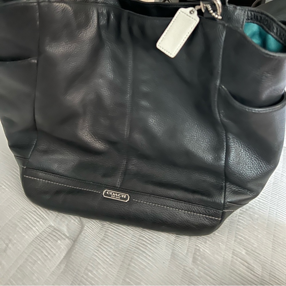 Beautiful coach bag. Black with green lining